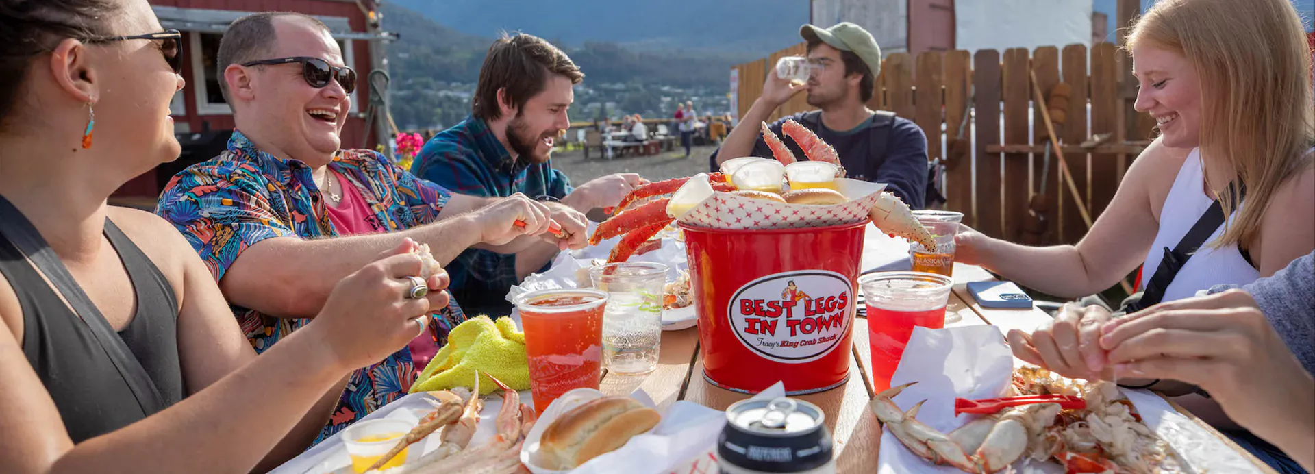 Communal picnic tables at an outdoor seafood spot