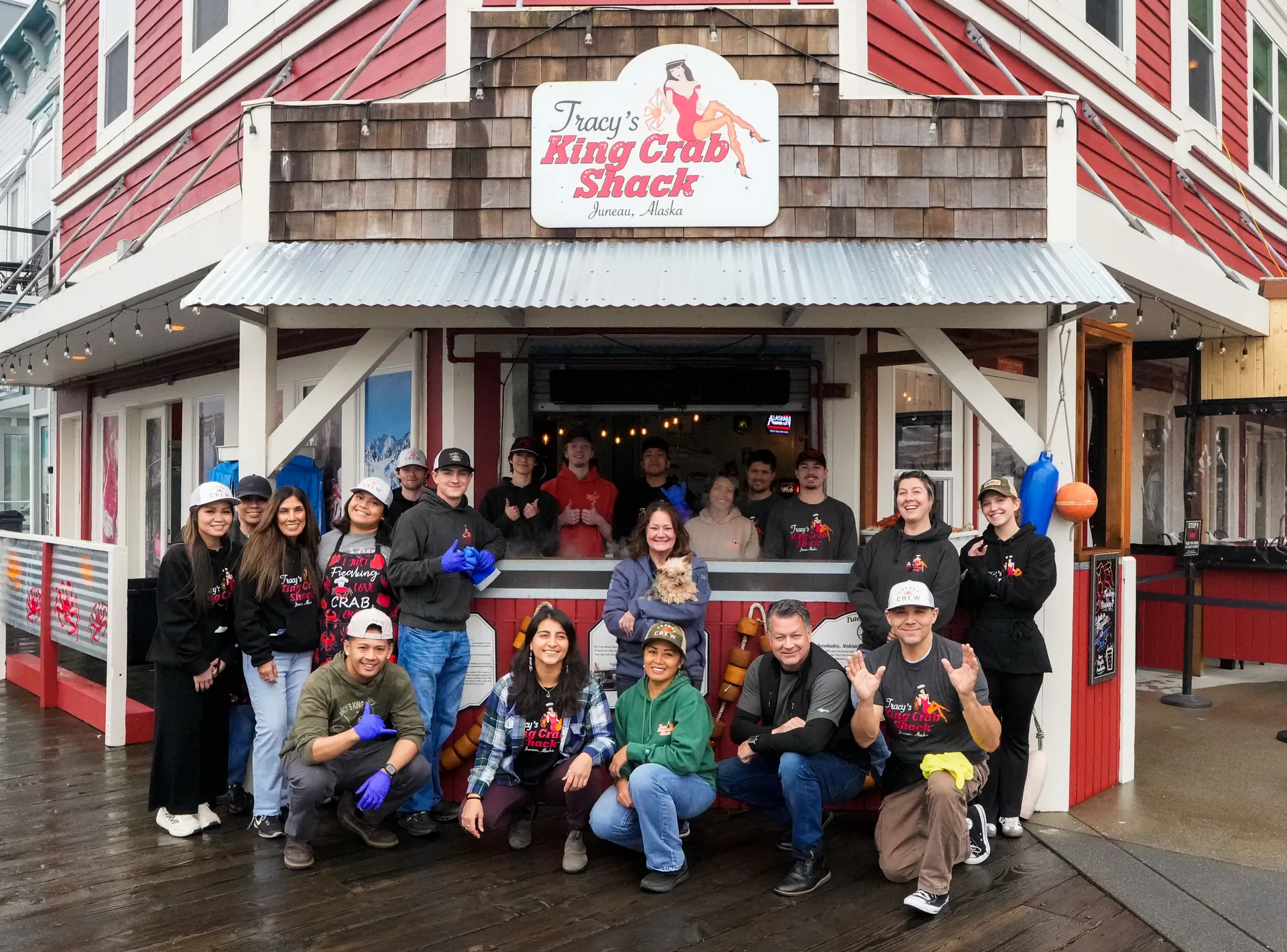Guests digging into king crab at Tracy's while they wait